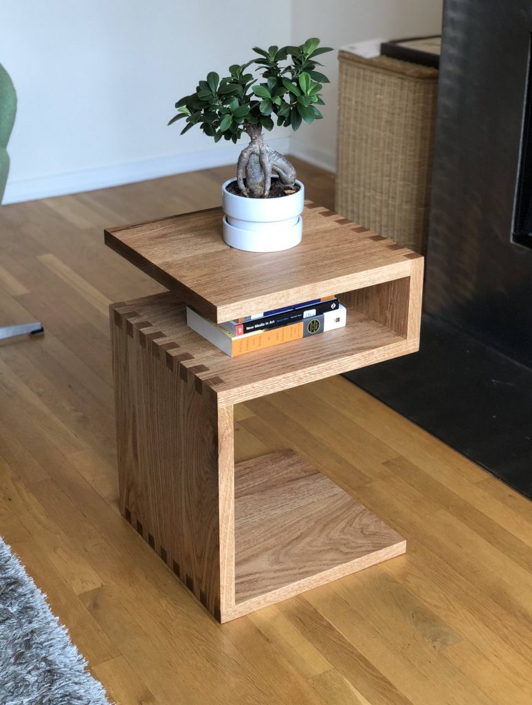 bonsai on table and books