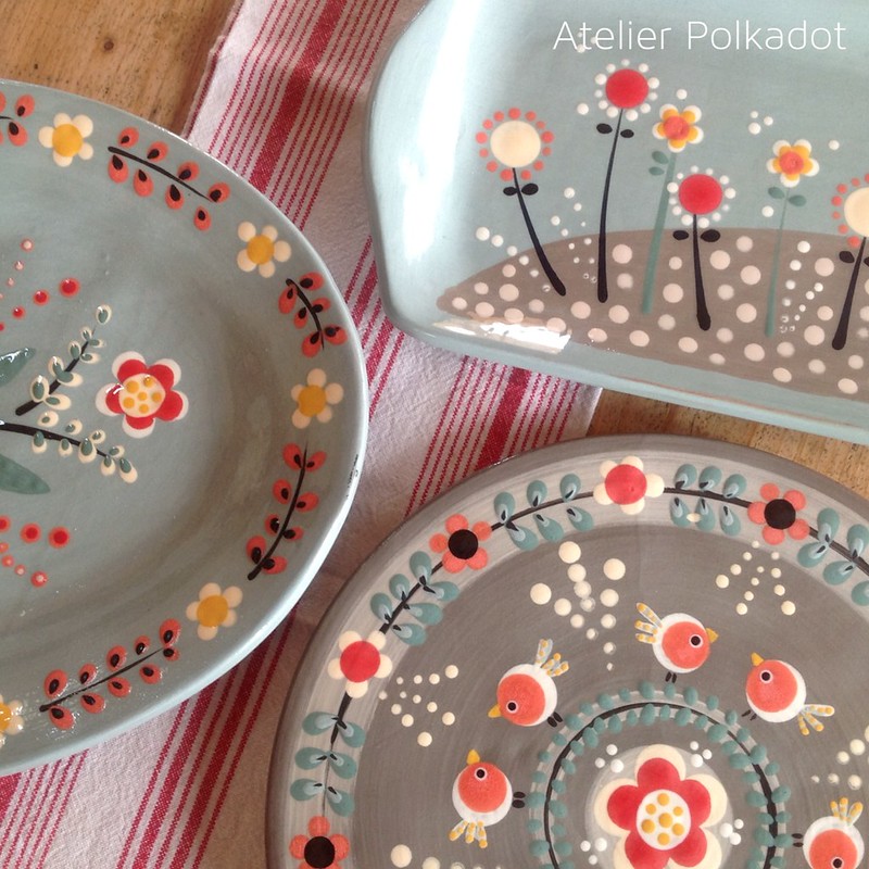 dark color plate and bowls painted with a lots of colors